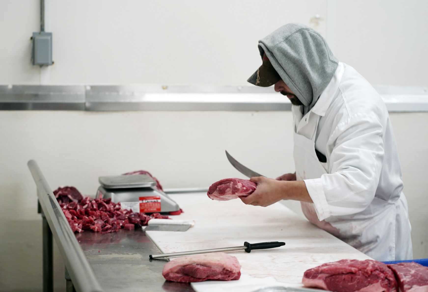 Preparing meat at Wohrle’s Foods